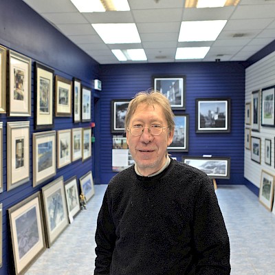 Geoff with his paintings
